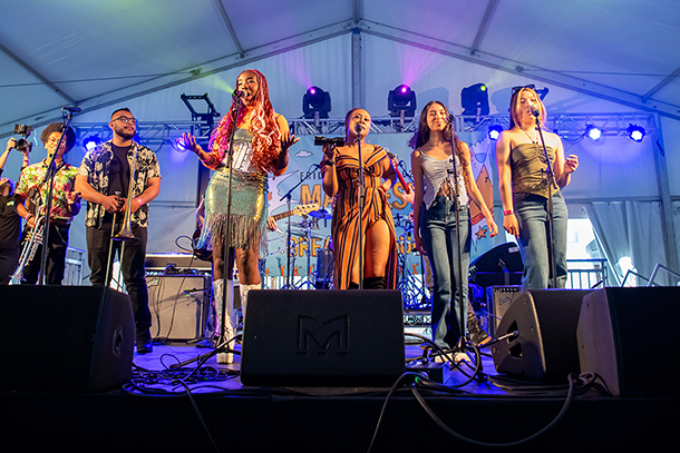 a group of students performing on stage